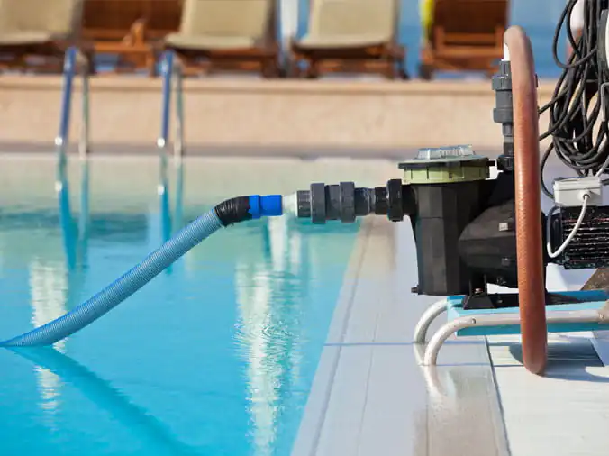 Pool vaccuum on the side of a private pool